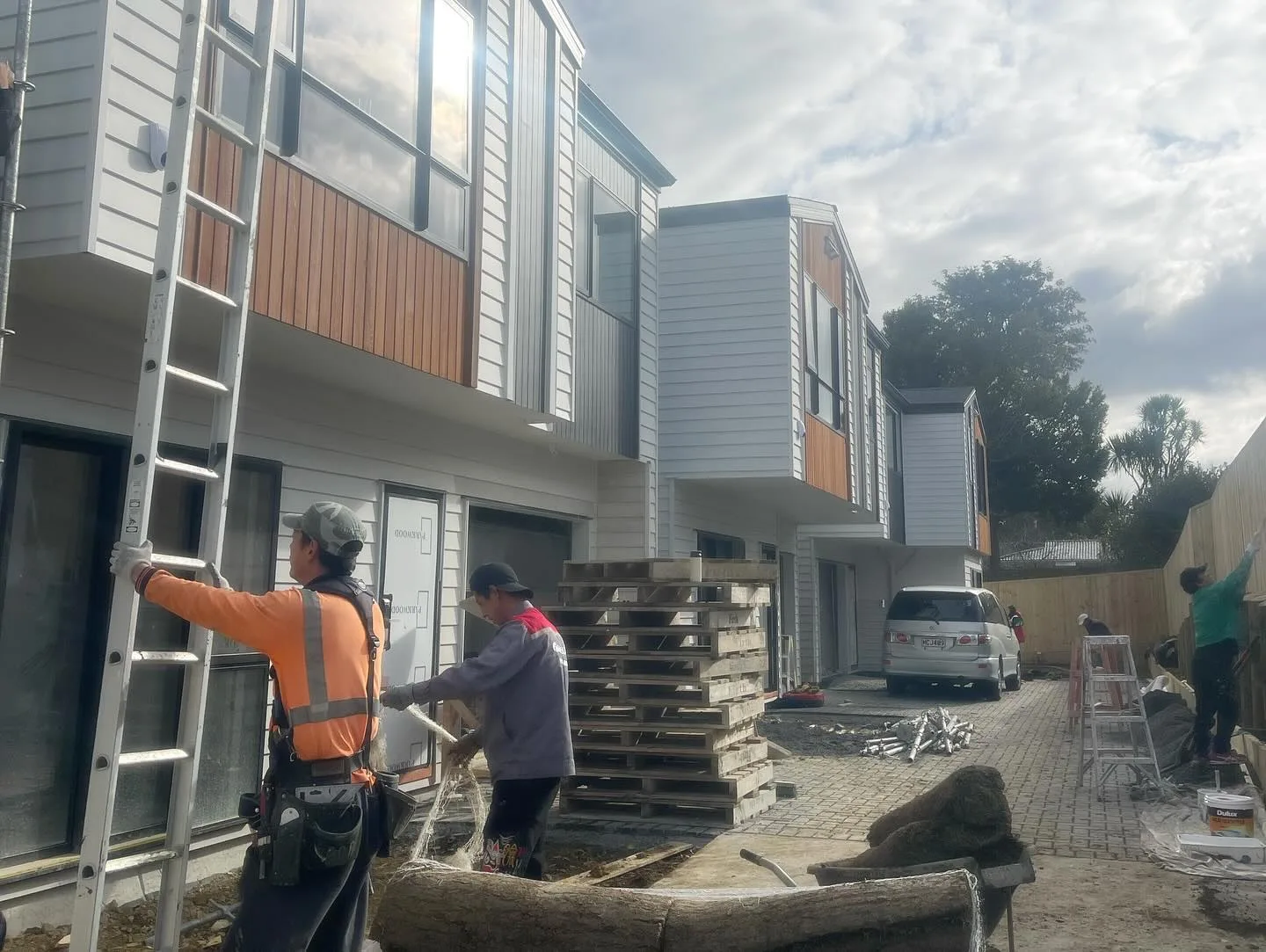 Exterior work area beside a row of townhouses